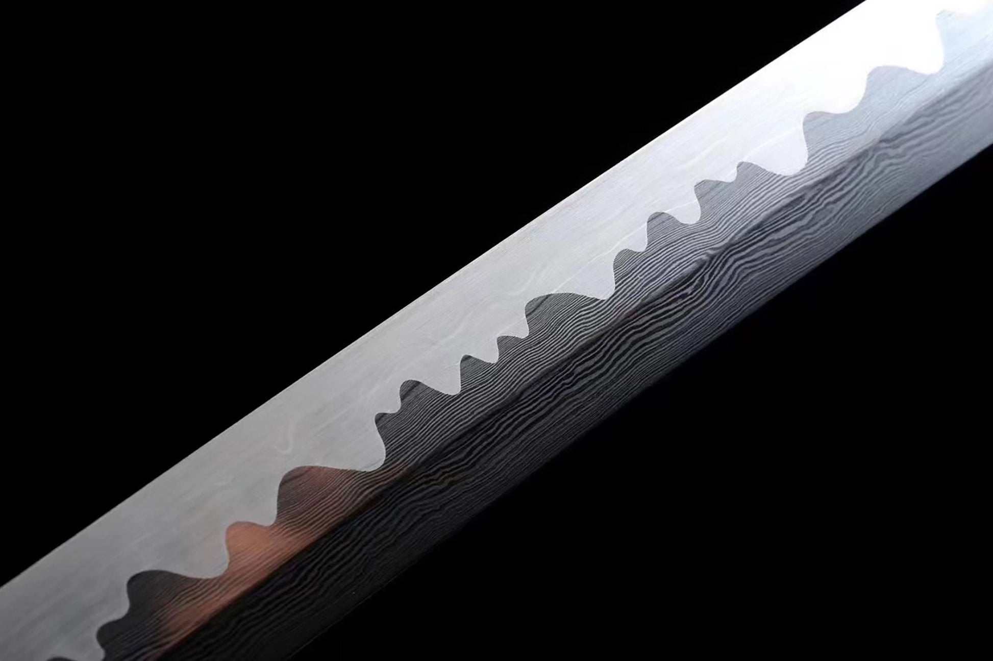 a large knife with a wooden handle on a black background