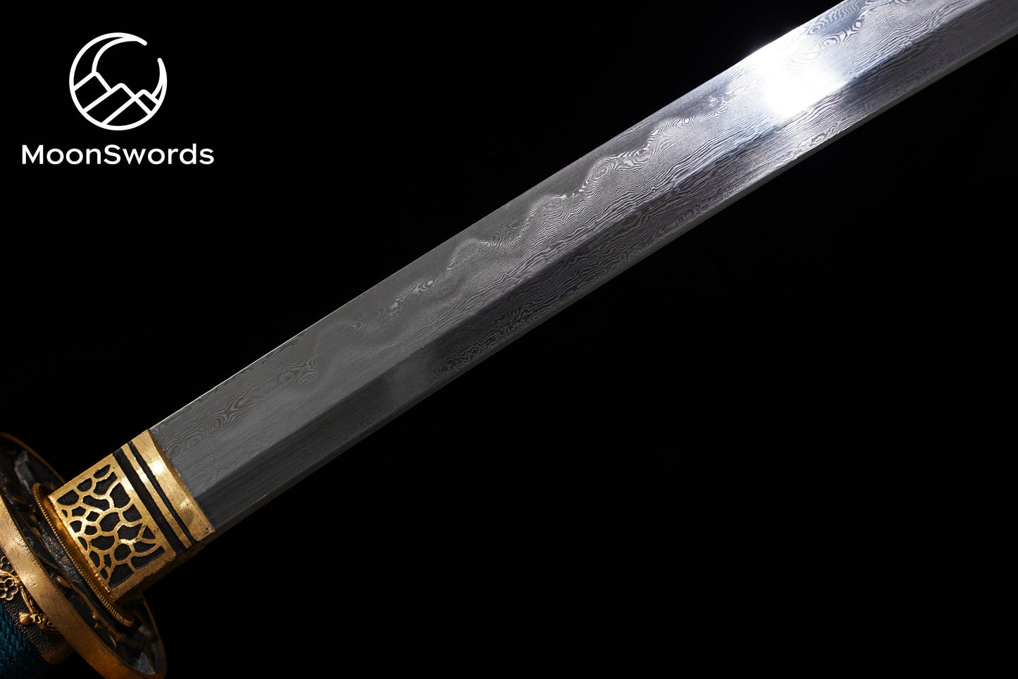 a knife with a gold handle and a blue blade