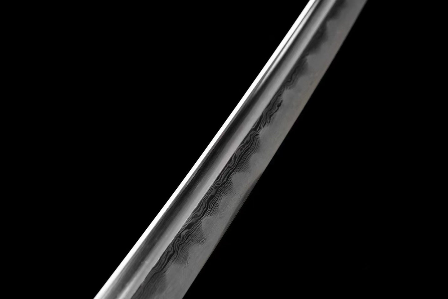 a close up of a sword on a black background