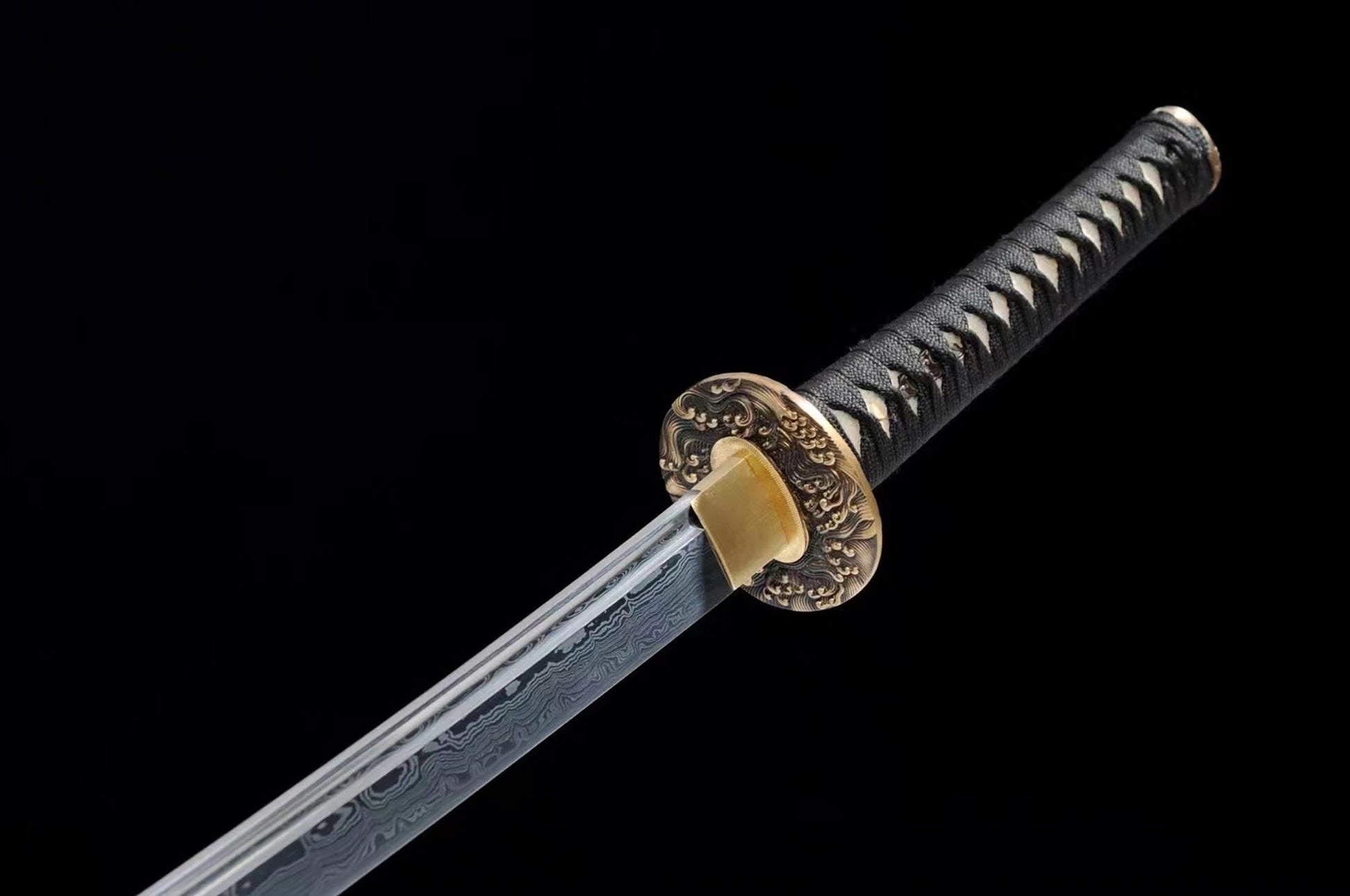 a close up of a sword on a black background